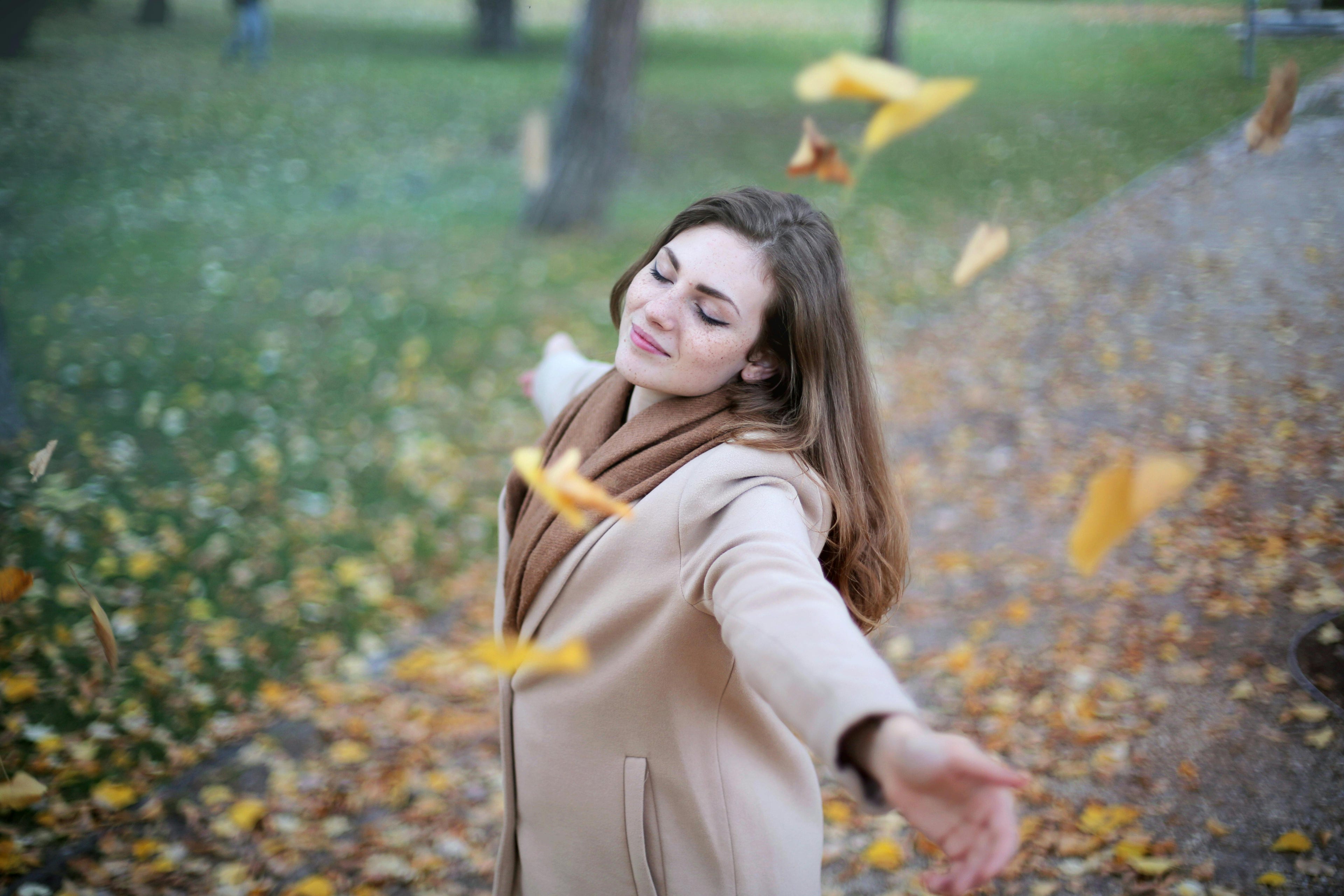 Happy woman outdoors in autumn — Lipids HbA1c combined blood test for cholesterol, diabetes and full blood count